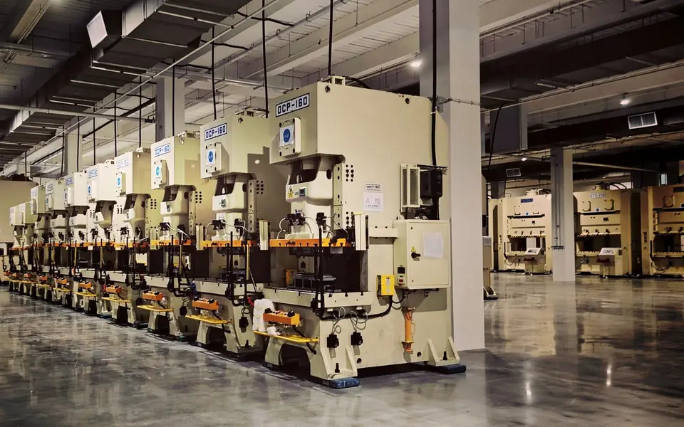 Row of stamping presses on a manufacturing floor